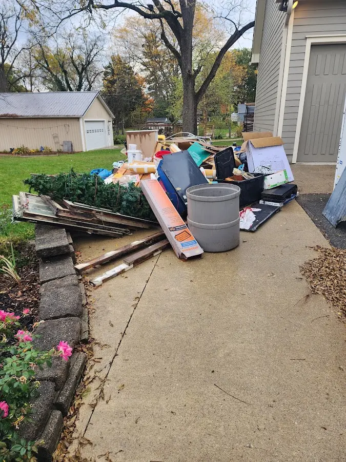 Dumpster being loaded with debris for 3 Yard Dumpster Rental in Champaign